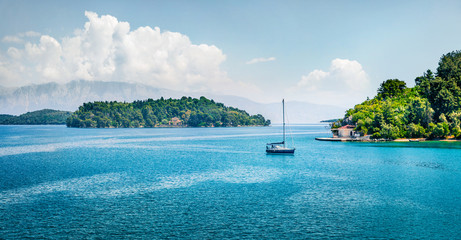 Obraz premium Panoramic spring view of port Nydri. Colorful morning seascape of Ionian Sea. Amazing outdoor scene of Lefkada island, Greece, Europe. Traveling concept background.