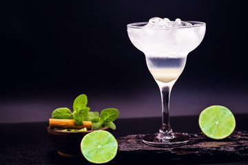 Frozen margarita in glasses, refreshing lemon alcohol drink and lots of ice, summer drink.
