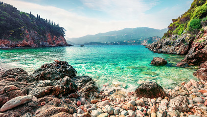 Wonderful spring view of Limni Beach Glyko. Colorful morning seascape of Ionian Sea. Picturesque...