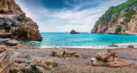 Attractive spring view of Gyali beach. Sunny morning seascape of Ionian Sea. Fantastic outdoor scene of Corfu island, Greece, Europe. Beauty of nature concept background.