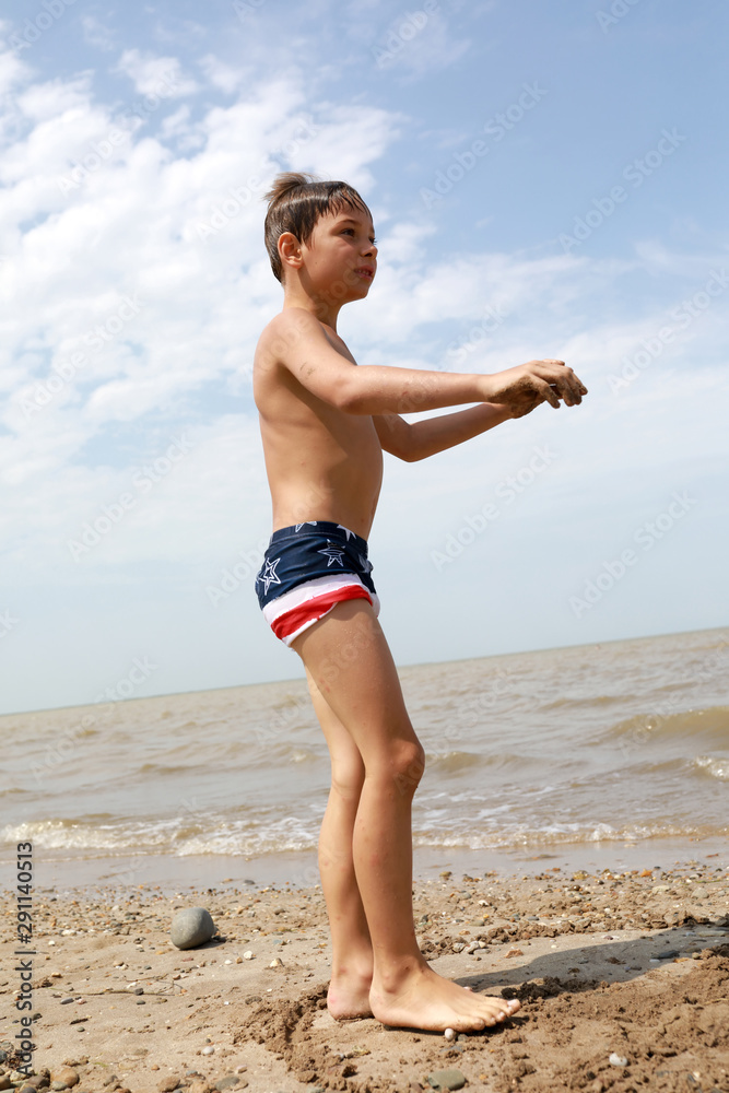 Wall mural child on beach of the sea of azov