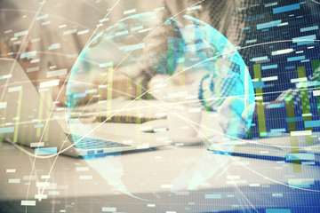 Multi exposure of businessman working on laptop on background. International business hologram in front. Concept of success.