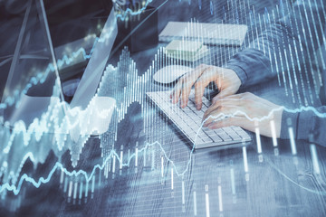 Double exposure of financial graph with man works in office on background. Concept of analysis.