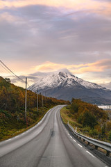 Scenic asphalt road through the beautiful view of mountain in lofoten island, Norway during autumn. Concept of roadtrip, travel, vacation, adventure