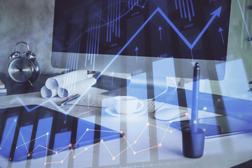 Forex market chart hologram and personal computer background. Double exposure. Concept of investment.