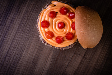 Double craft beef burger with cheddar cheese, caramelized onion.and pepper pout on wood table and rustic background.