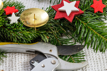 Decoration of handmade red and white advent christmas wreath from fir