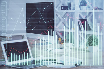Financial graph colorful drawing and table with computer on background. Double exposure. Concept of international markets.