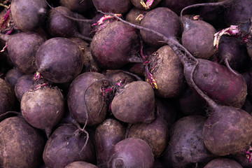 Pile of homegrown or farmgrown beets, may be used for background or texture