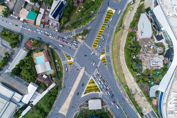 Drones Aerial View top down of road junction from above Image for transportation background,automobile traffic of many cars and sign,symbol on road