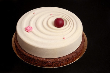 Vortex white glazed cake with a red ball