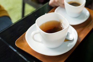 cup of tea with lemon on wooden table
