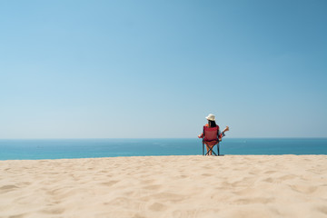 Woman sitting on a chair have an amazing view