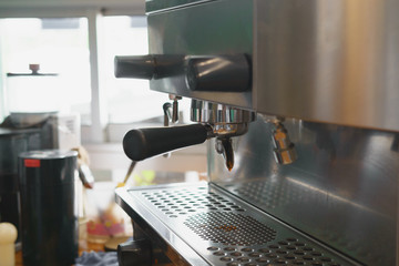 barista pouring coffee in machine