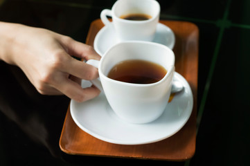 cup of coffee with woman hand