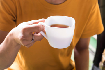 young woman with a cup of coffee