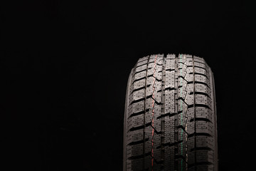winter friction tire Velcro without spikes close-up on black background. blank space for text,...