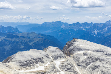 Obraz premium Mountain view and the trail with climbers walking along the path to the Piz Boe mountain shelter. Italian Dolomites, Alto Adige