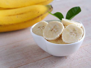 Sliced banana in bowl on table, Healthy fruit.