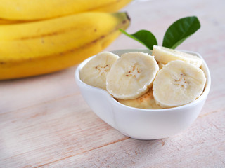 Sliced banana in bowl on table, Healthy fruit.