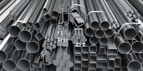 Different metal rolled products. Stainless steel profiles and tubes. in warehouse background. © Maksym Yemelyanov