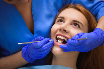 Dentist examining a patient's teeth in the dentist.