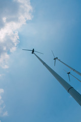 low angle shot of wind mil and blue sky