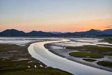 A view of the Suncheonman Bay Wetland Reserve in South Korea during dusk.