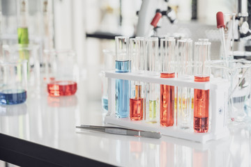 Team of Medical Research Scientist Conducts Experiments in Laboratory with Microscope, Test Tubes, Micropipette and other equipment.