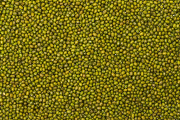 Macro image of green mung beans pile as food background. Healthy lifestyle concept.