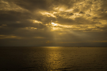 The surface of the sea is reflected in warm colors.
