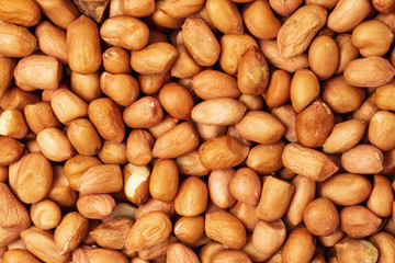 Macro top view image of salted peanuts as a food pattern.