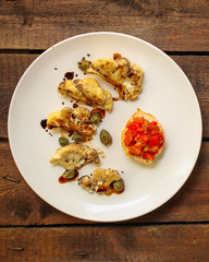cauliflower grilled (fried grill vegetables or snack salad, bruschetta with tomato) menu concept. food background. copy space. Top view