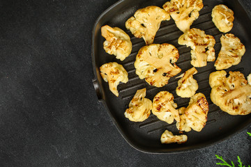 cauliflower grilled (fried grill vegetables or snack salad, bruschetta with tomato) menu concept. food background. copy space. Top view