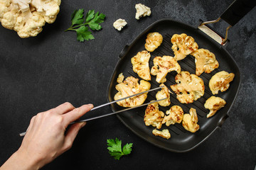 cauliflower grilled (fried grill vegetables or snack salad, bruschetta with tomato) menu concept. food background. copy space. Top view