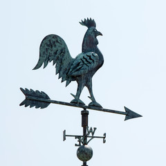 Weathervane in the form of a rooster on the roof.