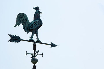 Weathervane in the form of a rooster on the roof.