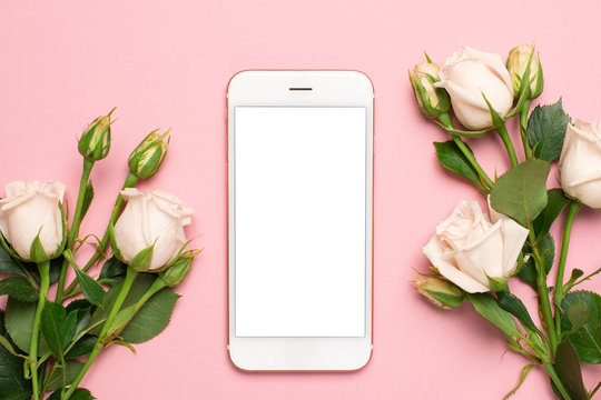 Mobile Phone With Roses Flowers On Pink Pastel Background, Women Technology Concept