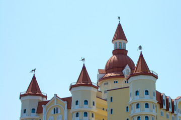 the roof of a medieval castle with towers, a modern building