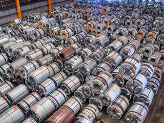 Steel coils at storage area in steel industry warehouse