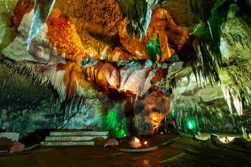 Stalactites and stalagmites in cave, Thailand