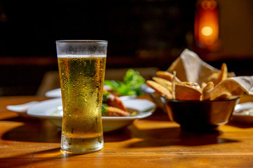 Glass of beer and asian food.