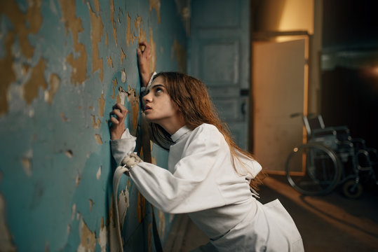 Female patient in strait jacket, insanity