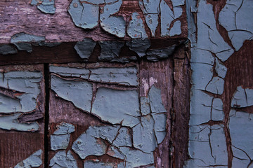 Cracking and peeling paint on a wall