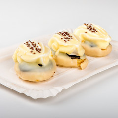 mini cakes on white paper tray