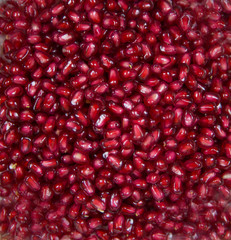 Background of red ripe pomegranate seeds. Raw organic fruits vegetables. Useful product.