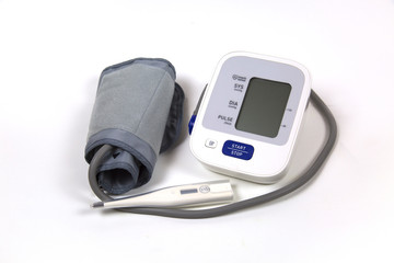Blood pressure tonometer with electronic thermometer isolated on white background. Medicine health technology.
