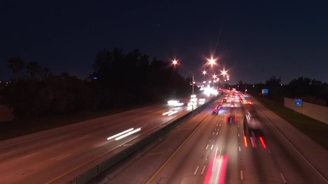 Interstate 95 at 48th Street in Deerfield Beach, Florida at Night with Cars Creating Short Streaks in a Slow Shutter-Speed Time-Lapse