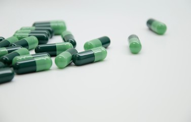Green capsules in the pharmacy laboratory