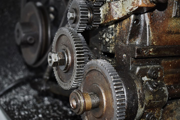 The gear is part of the lathe. Selective focus.